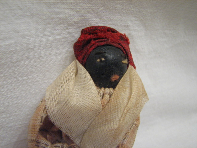 An early Black American finger puppet doll. In fair to good condition 